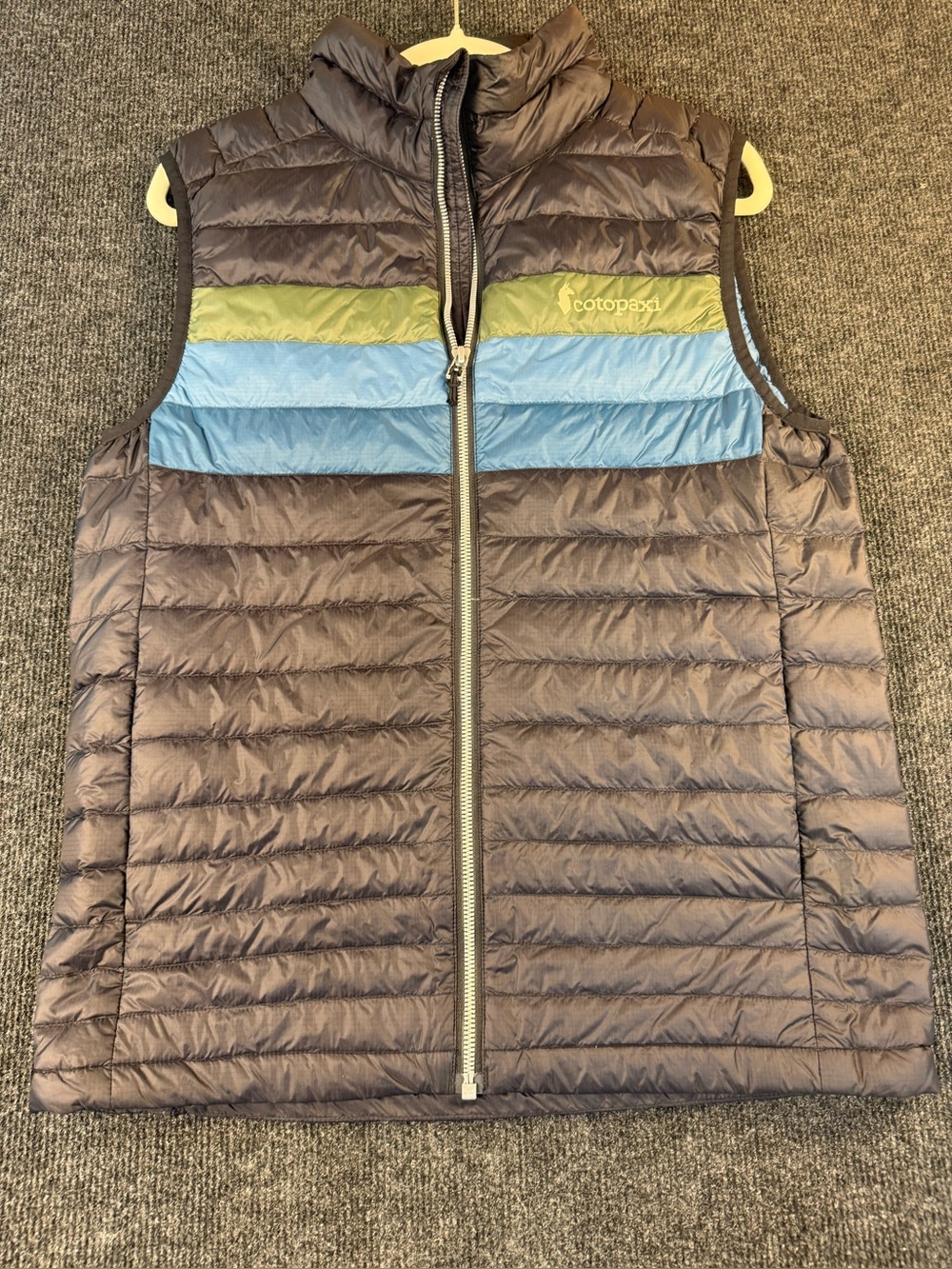 Cotopaxi Black Quilted Vest with Blue and Green Stripes
